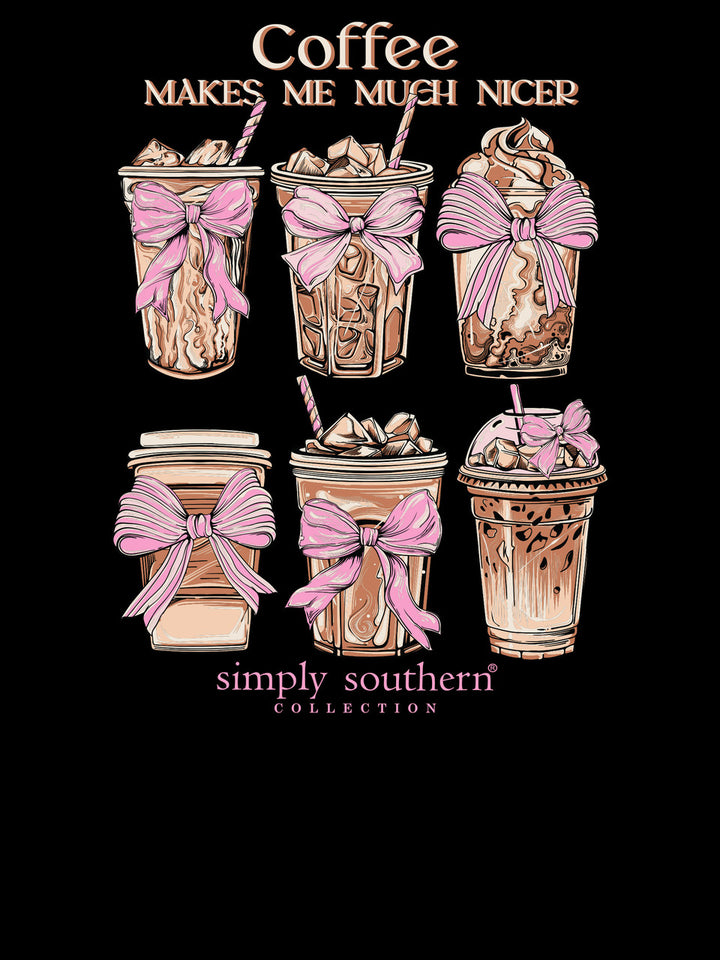 Black long sleeve T-shirt with six cute coffee drink illustrations, pink bows, and "Coffee makes me much nicer" slogan. Sizes S-XL.
