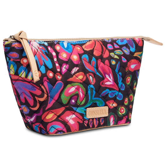 The Sam Large Tool Kit is a vibrant quilted fabric pouch with abstract floral and leaf patterns in red, blue, purple, and green. It includes a leather zipper pull and a beige brand tag. Available in one size.