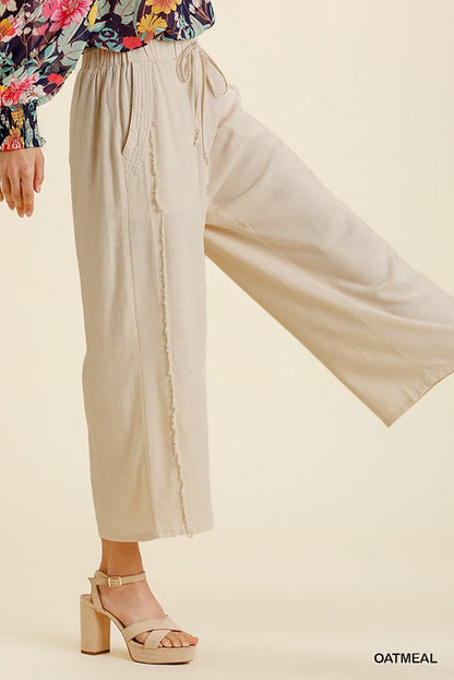 Linen frayed edge wide leg pants with pockets, available in XS-XL.