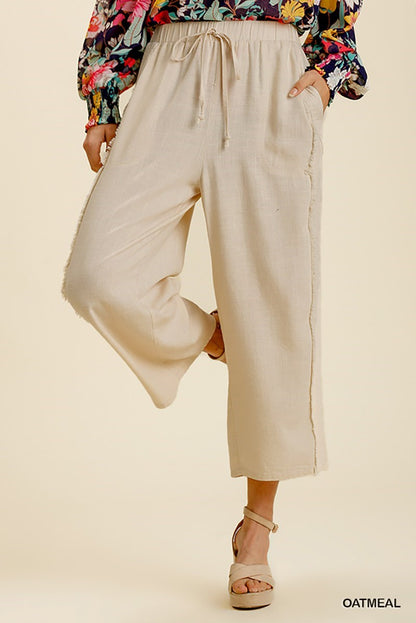 Linen Frayed Edge Wide Leg Pants with Pockets in oatmeal. Available in sizes XS-XL.