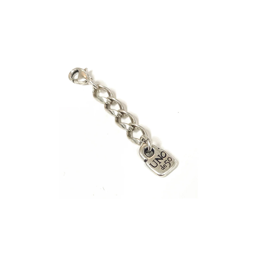 Silver chain link extension with a small square "UNO de 50" engraved pendant; available in multiple sizes for use as bracelet or necklace extender.