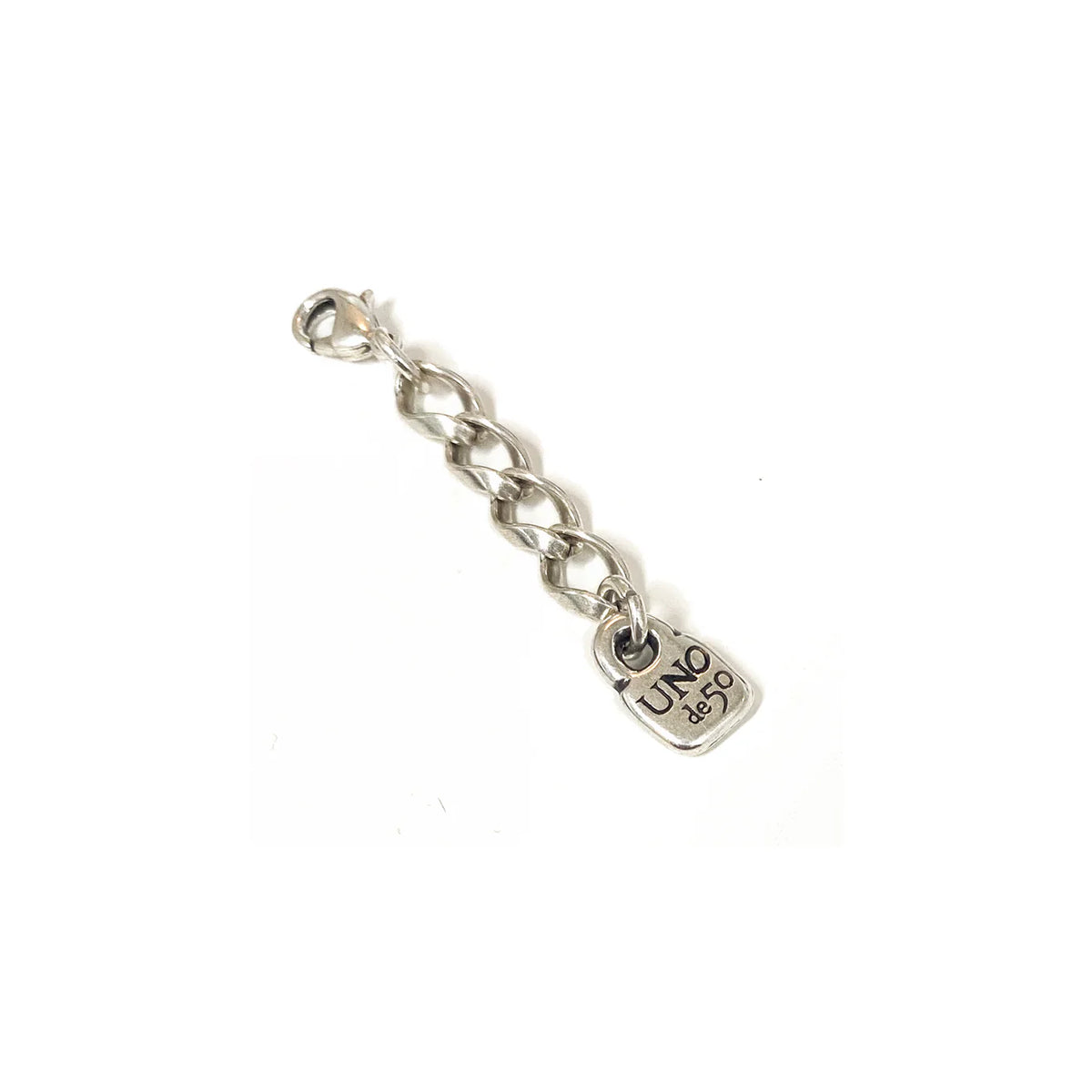 Silver chain link extension with a small square "UNO de 50" engraved pendant; available in multiple sizes for use as bracelet or necklace extender.