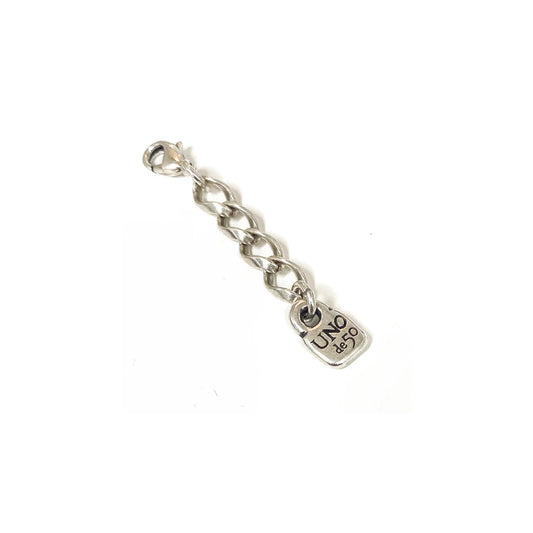 Silver chain link extension with a small square "UNO de 50" engraved pendant; available in multiple sizes for use as bracelet or necklace extender.