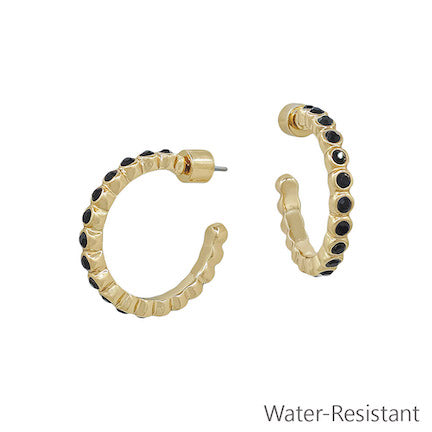 Viena Black Stone Hoop Earrings in gold-tone with black stones on the outer edge; water-resistant. Available sizes: small, medium, large.