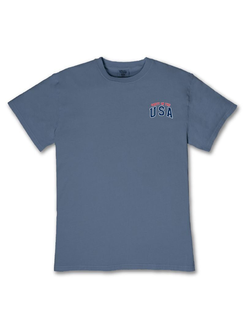 Blue tee with "Home of the USA" in small red and white text on upper left chest. Available in sizes XS–XL.
