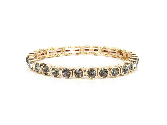 Morgan Gold Crystal Stone Stretch Bracelet with round, bezel-set dark stones in a continuous gold setting; available in sizes S/M and M/L.