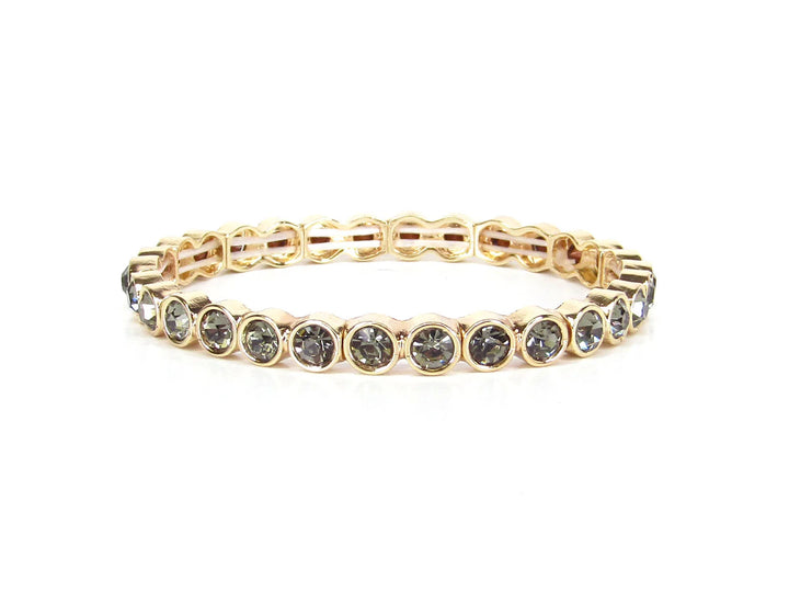 Morgan Gold Crystal Stone Stretch Bracelet with round, bezel-set dark stones in a continuous gold setting; available in sizes S/M and M/L.