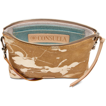 Small tan leather wristlet with white splatter pattern, zipper closure, blue lining, interior “Consuela” label, and card pocket. Available in one size.