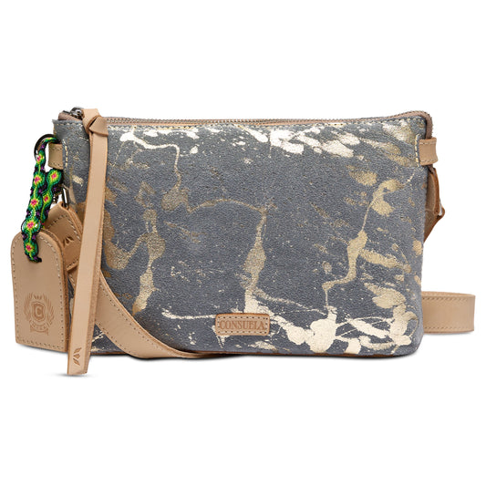 Small metallic leather crossbody bag in gray and gold abstract pattern with tan leather accents, beaded keychain, leather tag, detachable strap, and “Consuela” embossed patch on front. Sizes available: small.