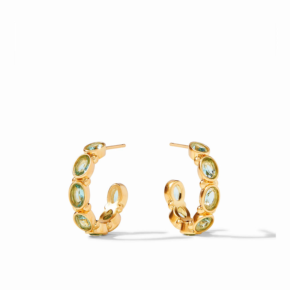 The Mykonos Hoop Earrings- Medium are gilded hoops with sparkling oval green gemstones. Available in medium size.