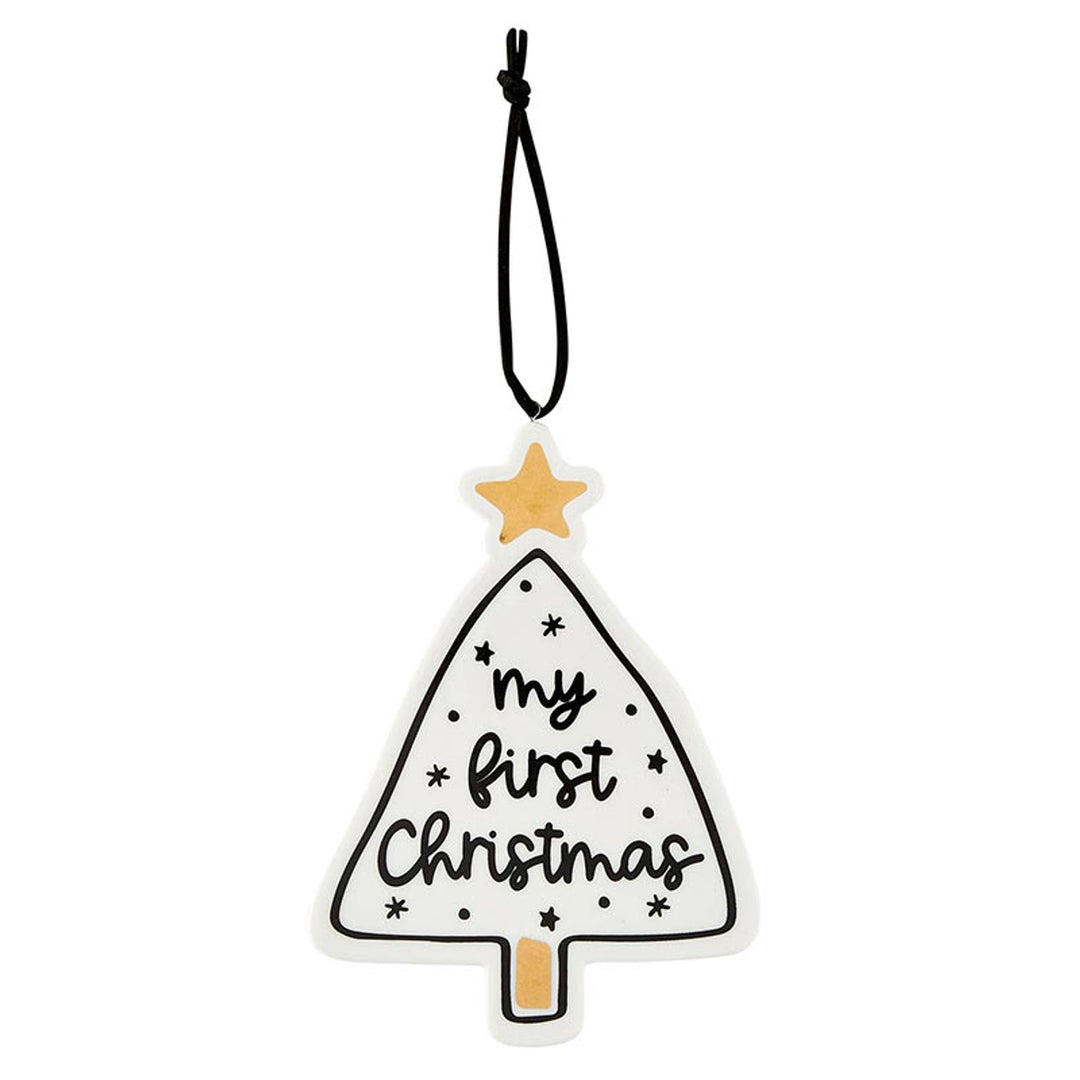 Christmas tree ornament with gold star and “my first Christmas” lettering on a black cord.