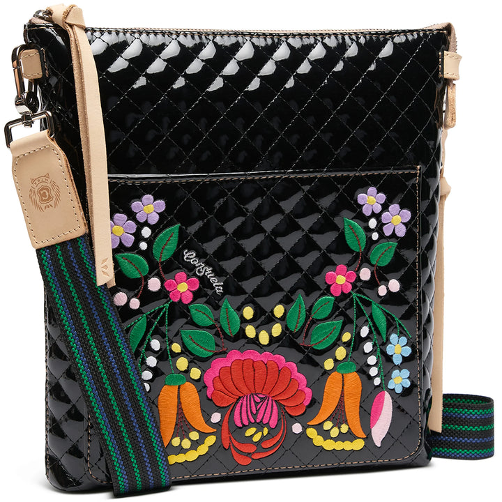 Black quilted crossbody with floral embroidery, tan leather trim, striped strap; sizes: S, M, L.
