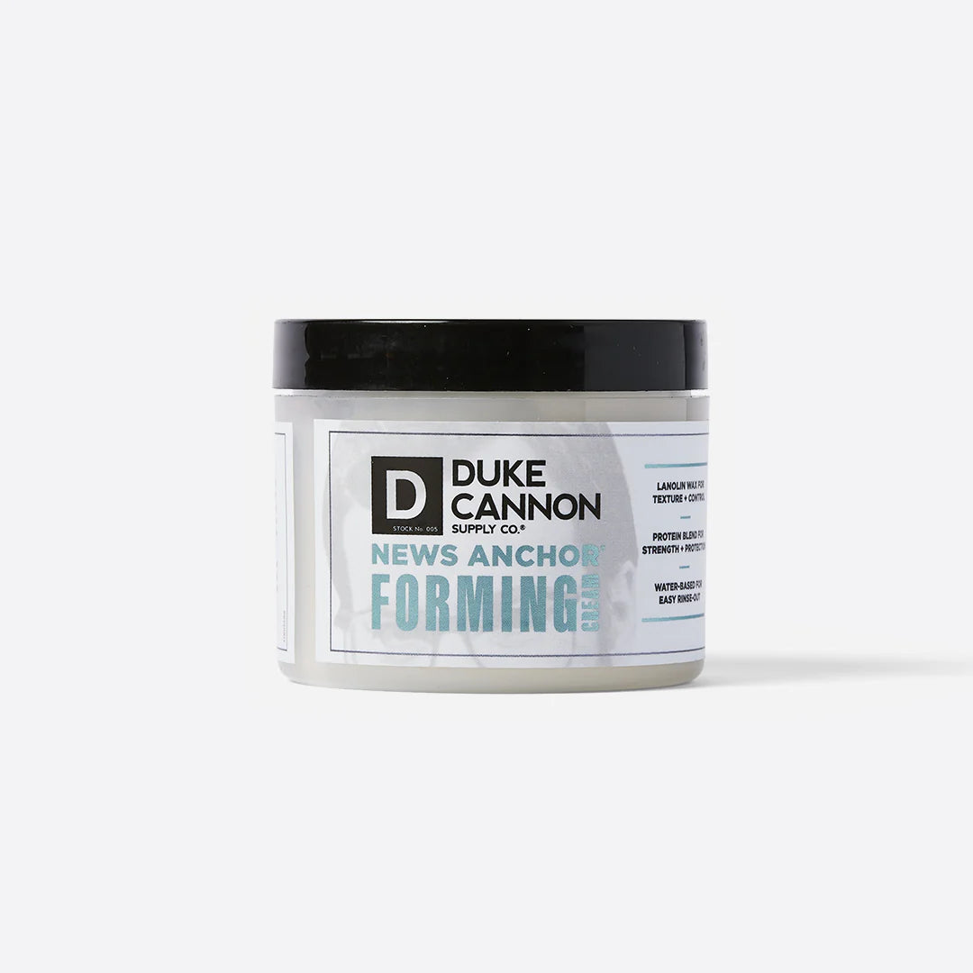 News Anchor Forming Cream – White jar with black lid, provides strong hold and matte finish for hair. Available in 4 oz and 2 oz sizes.