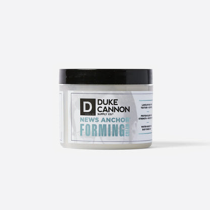 News Anchor Forming Cream – White jar with black lid, provides strong hold and matte finish for hair. Available in 4 oz and 2 oz sizes.