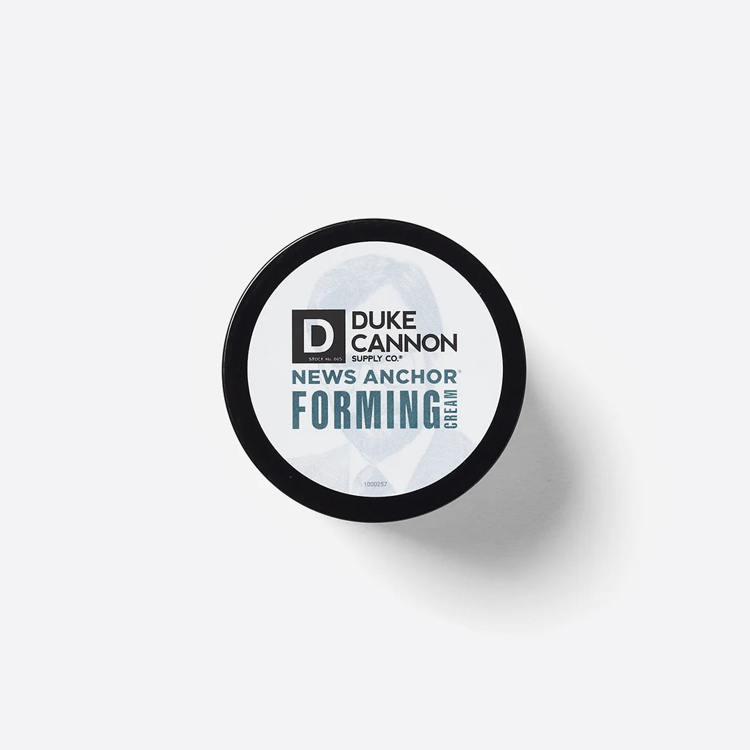 Round black container of News Anchor Forming Cream, water-based formula, strong hold. Available in 2 oz and 4 oz sizes.