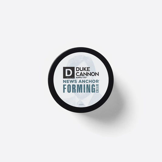 Round black container of News Anchor Forming Cream, water-based formula, strong hold. Available in 2 oz and 4 oz sizes.