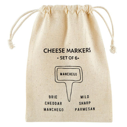 A set of 6 ceramic cheese markers in a beige drawstring bag with black text featuring cheese names like Brie, Cheddar, and Manchego. Ideal for labeling cheeses at parties. Sizes: N/A.