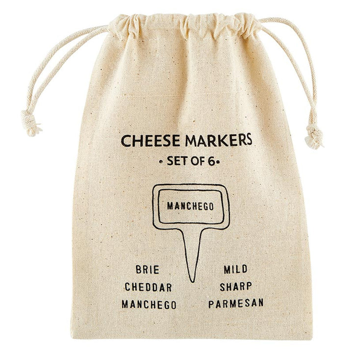 A set of 6 ceramic cheese markers in a beige drawstring bag with black text featuring cheese names like Brie, Cheddar, and Manchego. Ideal for labeling cheeses at parties. Sizes: N/A.