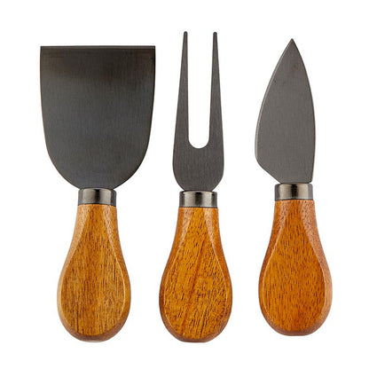 Here for the Charcuterie" Wood Handle Cheese Knives Book Box includes three cheese knives with acacia handles: flat spatula-style knife, two-pronged fork, and pointed blade. Handles are smooth and rounded. Sizes available: One Size.