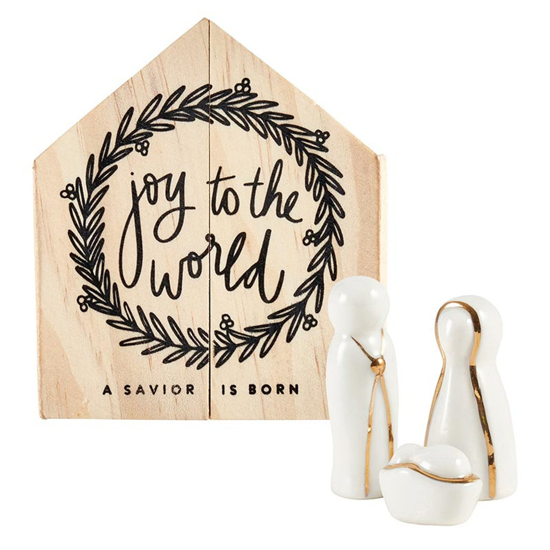 House-shaped pine wood box with wreath, “joy to the world,” and “A SAVIOR IS BORN” text.