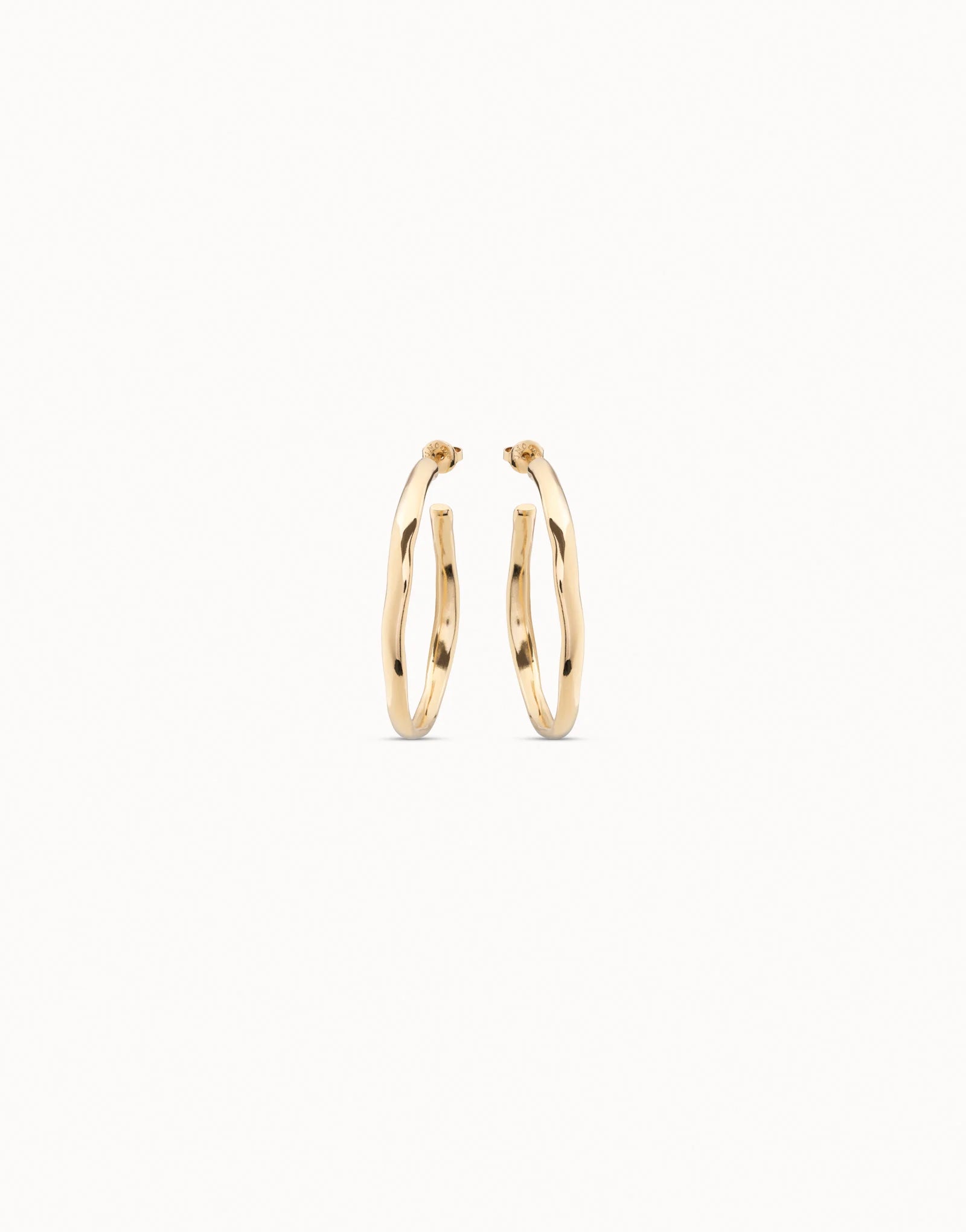 18K gold-plated open hoop earrings with a simple, elegant design, available in multiple sizes.