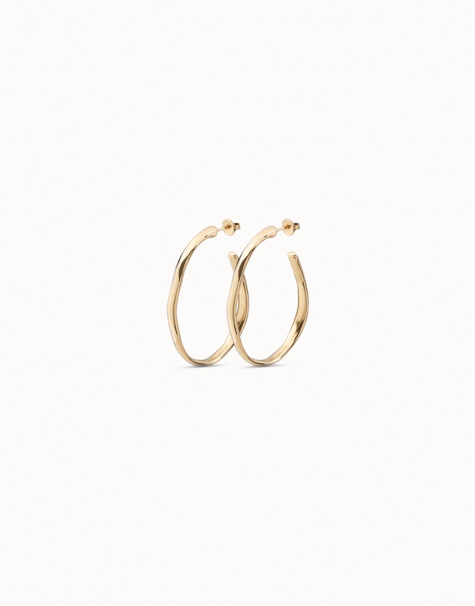 Open Hoop Earrings with shiny 18K gold-plated, subtly twisted handcrafted design inspired by UNOde50; available in multiple sizes.