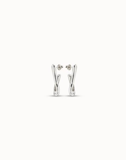 Silver link-shaped hoop earrings in handcrafted sterling silver with abstract twisted loops. Available sizes: small, medium, large.