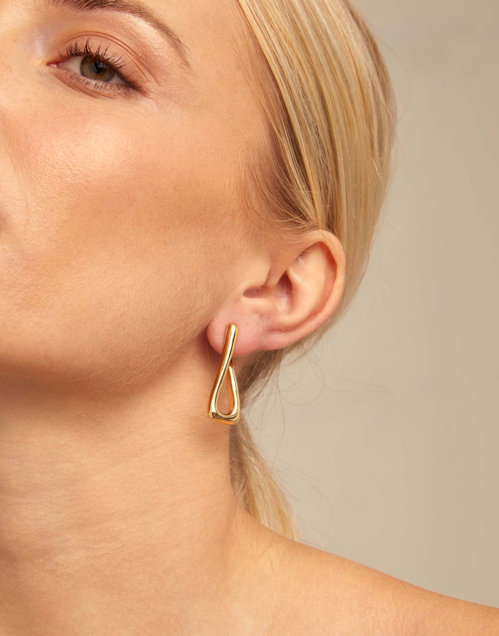 Gold link-shaped hoop earring shown; available in small, medium, and large sizes.