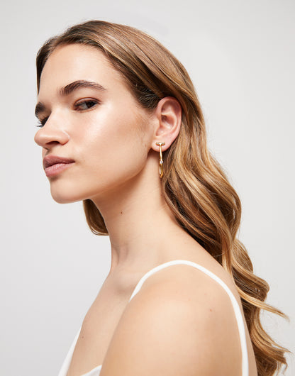 Elegant hoop earrings with white topaz, available in small, medium, and large sizes.