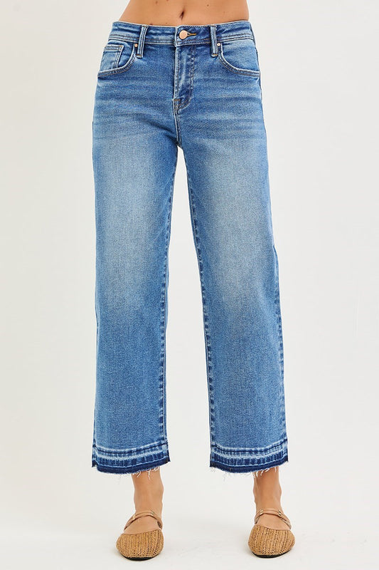 Risen Medium Wash Cropped Boyfriend Jeans with raw hems, available in sizes 24–32.