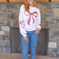 White Sequin Bow Crewneck Sweatshirt. Sizes: S, M, L, XL.