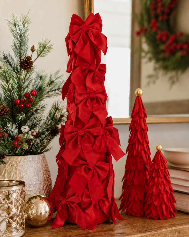 Three Velvet Decor trees in varying sizes: one cone-shaped tree with red fabric bows and two with red fabric petals and gold spheres.