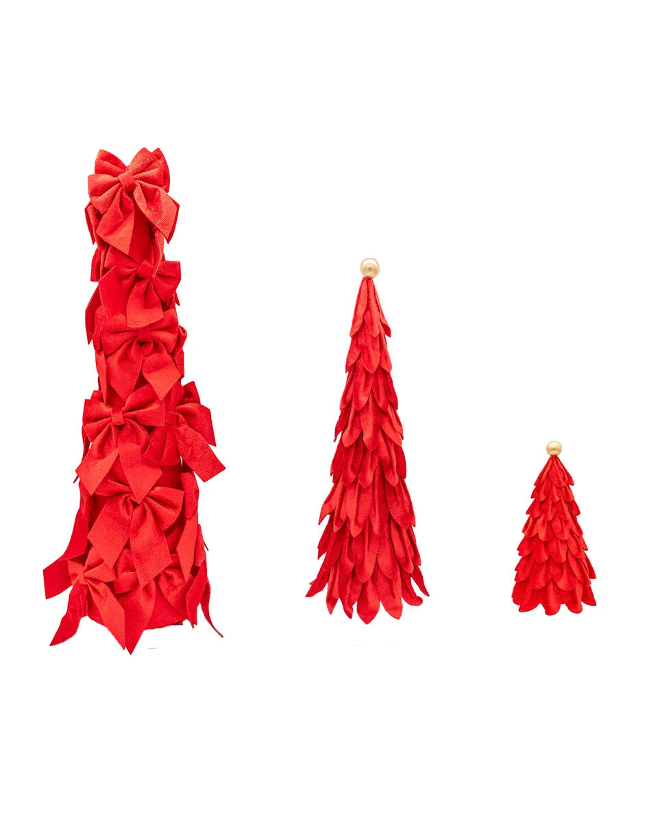 Three red velvet cone-shaped tree decorations in descending sizes; the largest features bows, and the two smaller ones feature fabric petals and gold-toned toppers.