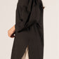Loose-fitting, long-sleeved black P. CILL Poplin Balloon Sleeve Button Up Shirt with a high-low hemline and puffy shoulders. Features side slit detail. 100% cotton.

Sizes: S, M, L, XL