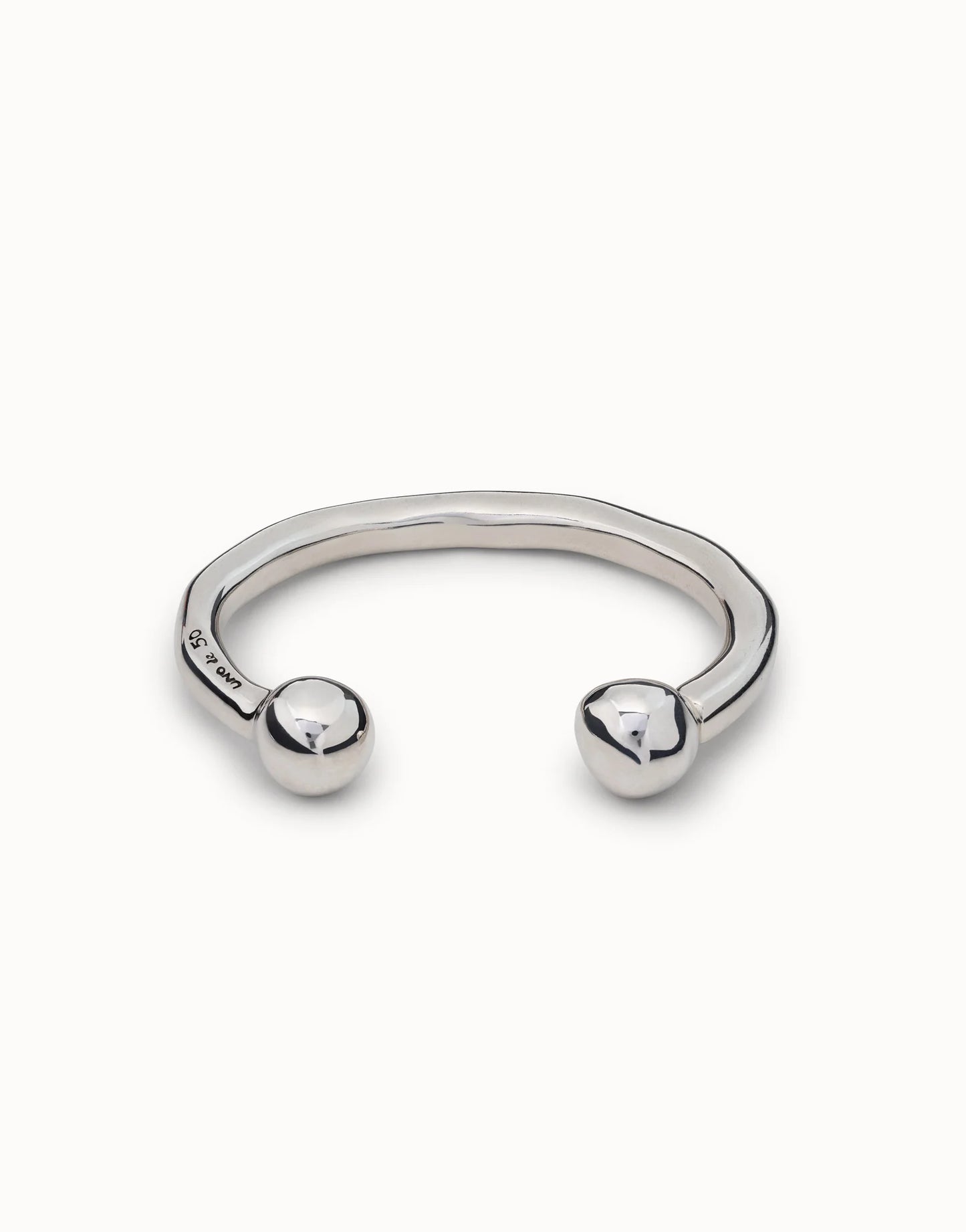Handmade sterling silver open cuff bangle with a wavy design and smooth round ball ends. Available in multiple sizes.