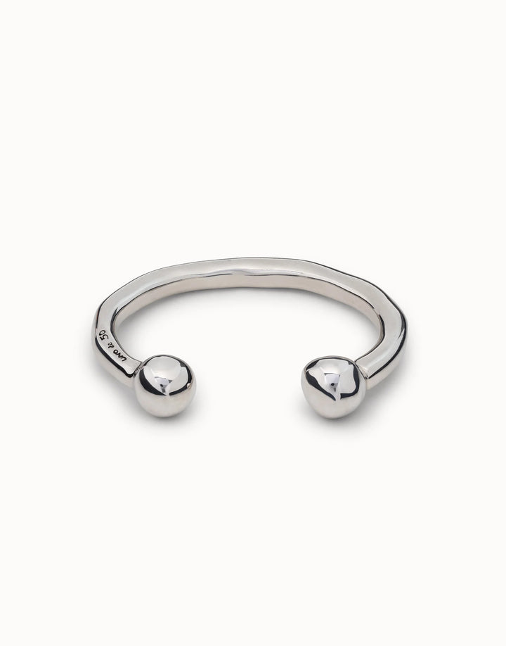 Handmade sterling silver open cuff bangle with a wavy design and smooth round ball ends. Available in multiple sizes.