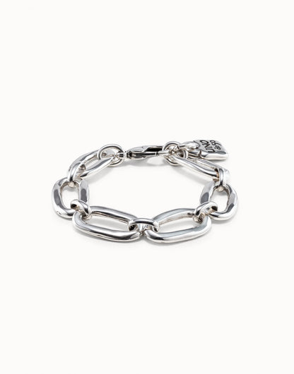 Sterling silver chunky link bracelet with large oval-shaped links and a small flat charm near the clasp, handmade in Spain. Available sizes: S, M, L.