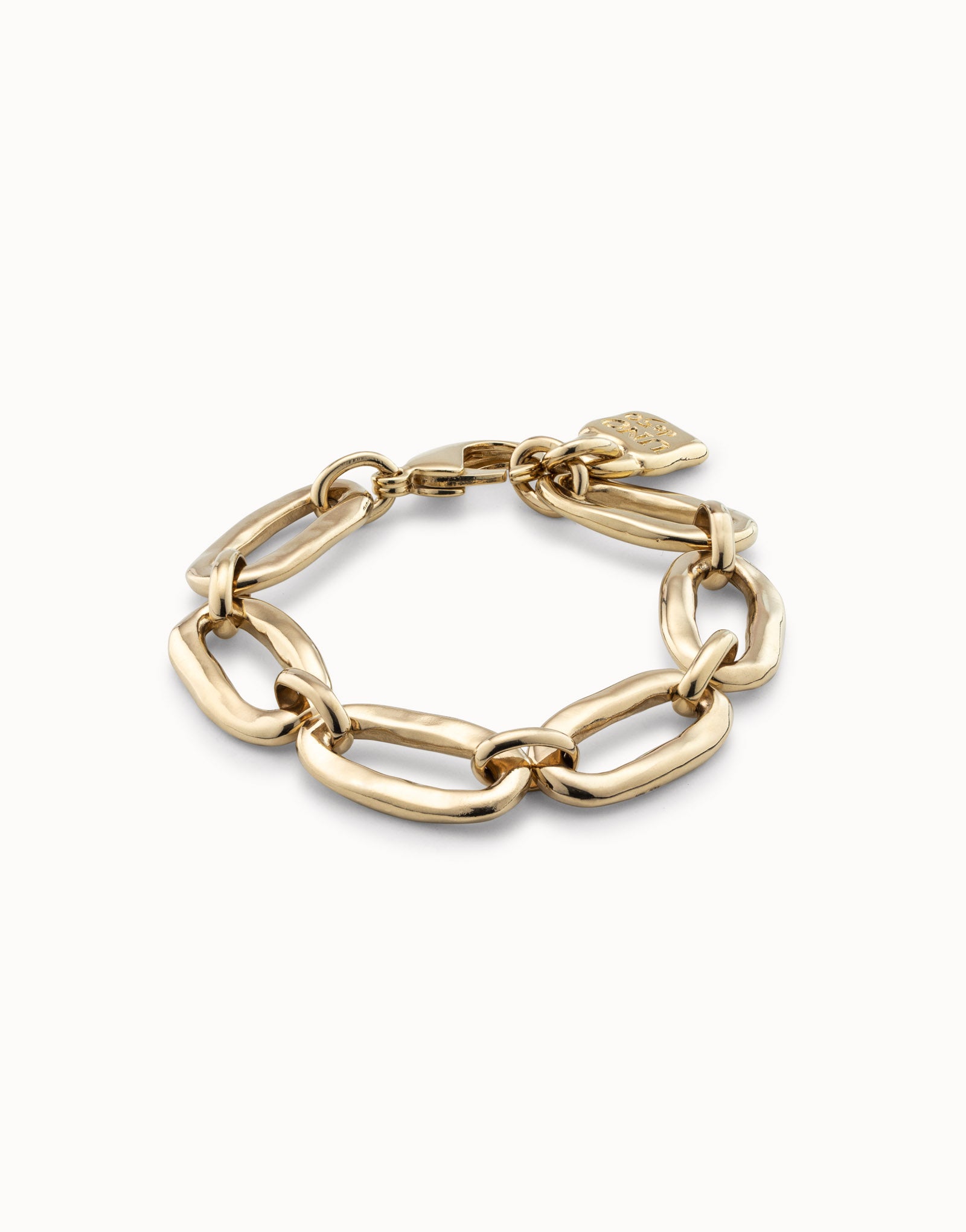 Gold Bracelet with chunky, handmade oval links and a small heart-shaped charm near the clasp by UNOde50; available in multiple sizes.