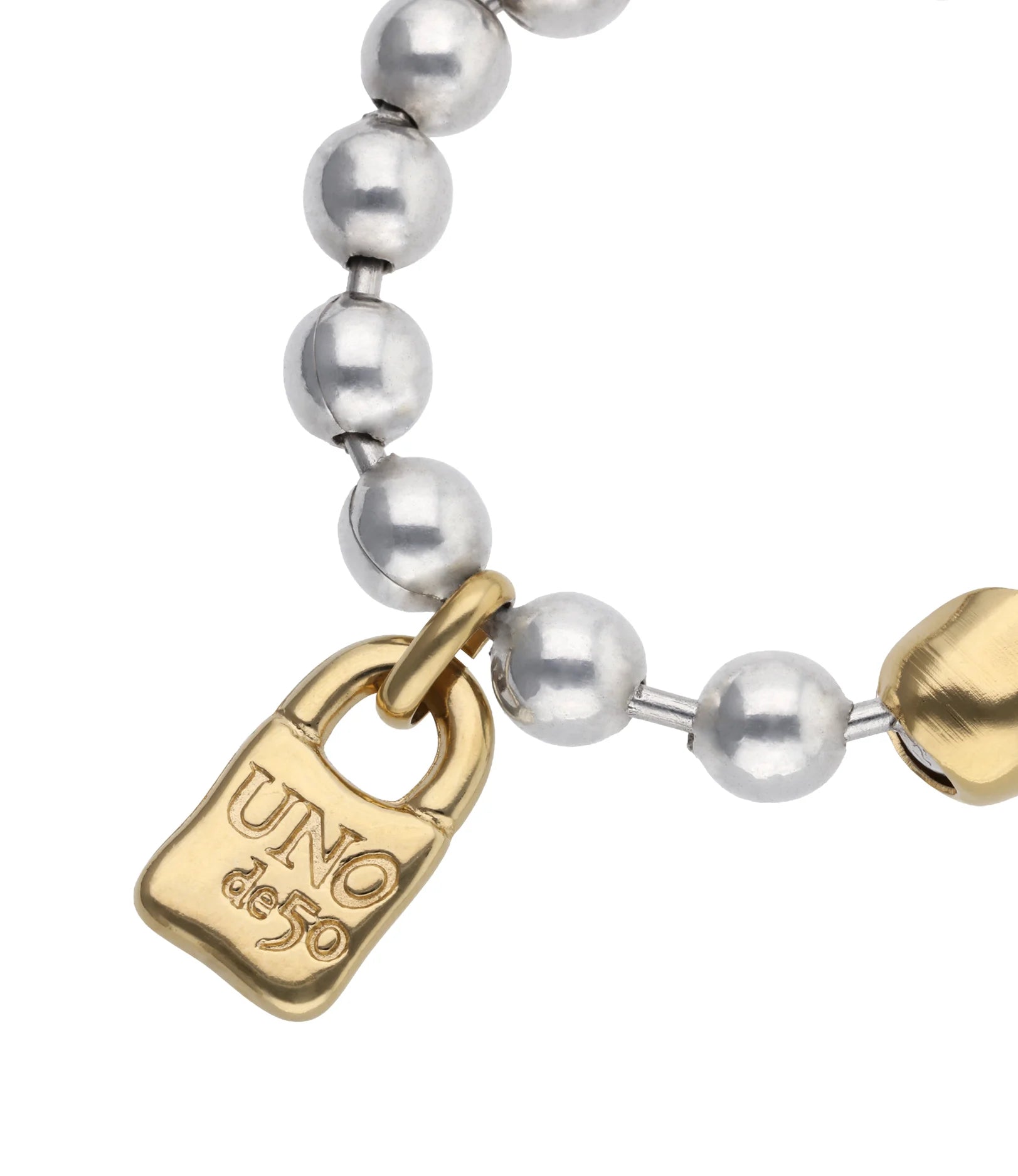Silver and gold beaded bracelet with a gold padlock charm engraved "UNO de 50"; available in sizes S, M, and L.