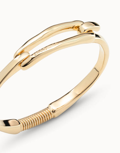Gold-plated Bangle Bracelet with Buckle, handcrafted in Spain, hinged clasp and ridged coiled detail at the end. Available in S, M, L.