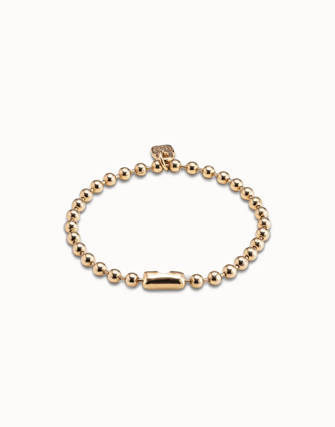 Gold-plated Beaded Charm Bracelet by UNOde50, handmade in Spain with intricate beading, rectangular clasp, and small square tag; available in multiple sizes.