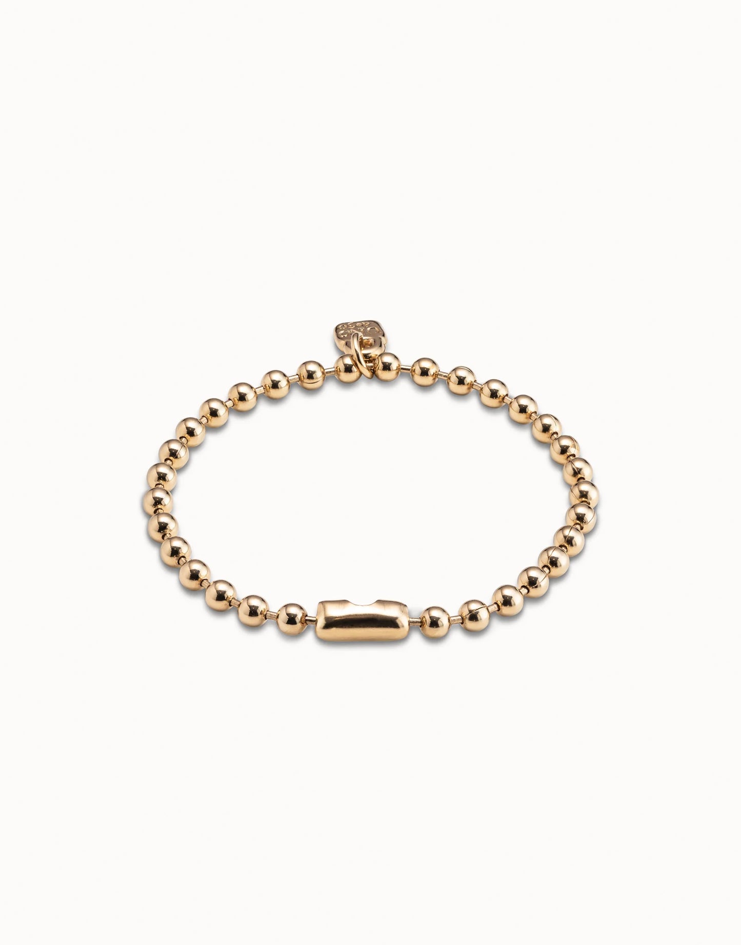 Gold-plated Beaded Charm Bracelet by UNOde50, handmade in Spain with intricate beading, rectangular clasp, and small square tag; available in multiple sizes.