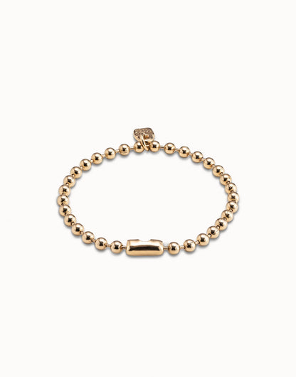 Gold-plated Beaded Charm Bracelet by UNOde50, handmade in Spain with intricate beading, rectangular clasp, and small square tag; available in multiple sizes.