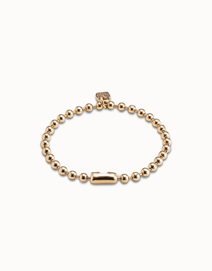Gold-plated Beaded Charm Bracelet by UNOde50, handmade in Spain with intricate beading, rectangular clasp, and small square tag; available in multiple sizes.