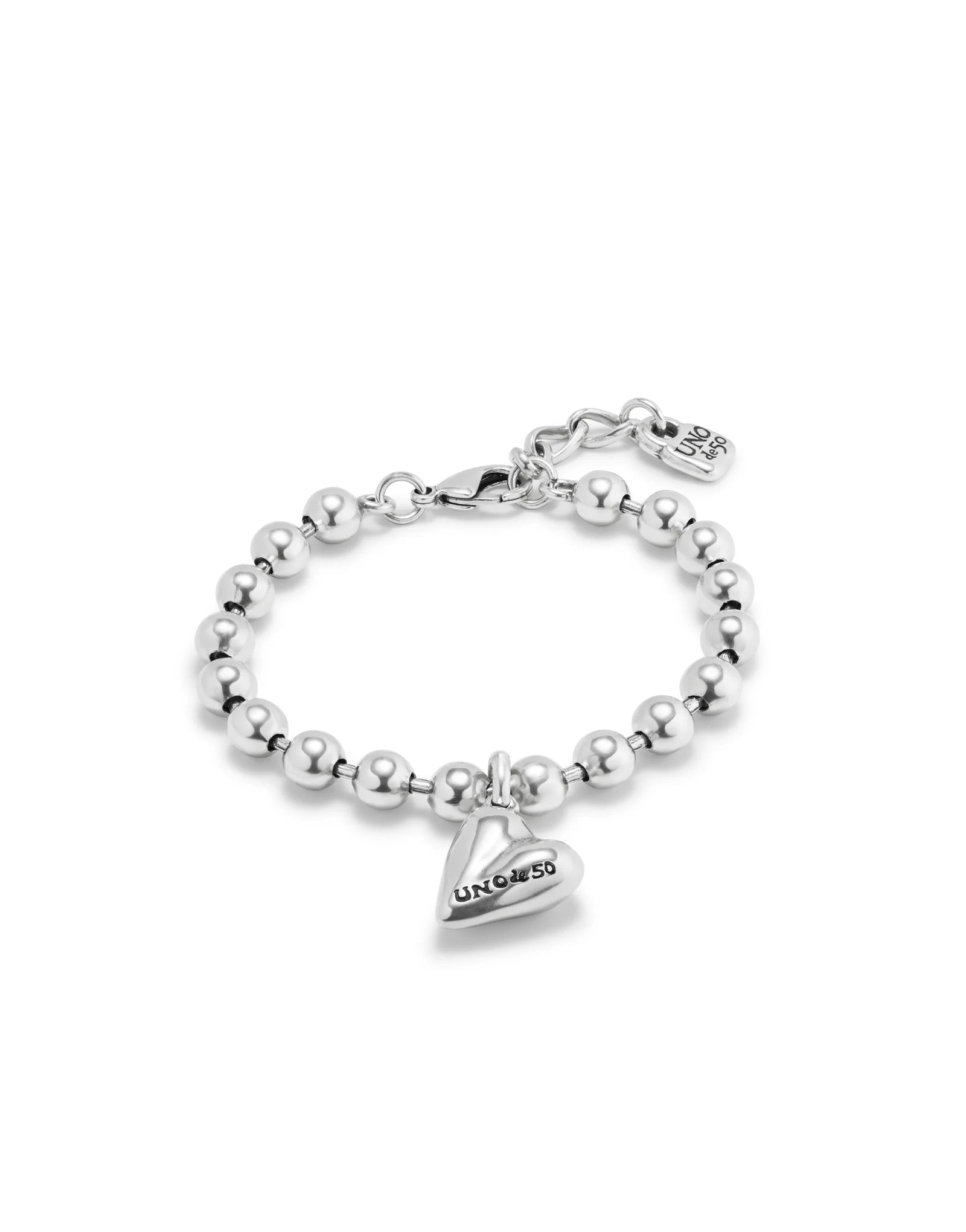 Polished sterling silver beaded bracelet with a heart-shaped "UNOde50" charm, adjustable clasp, and small rectangular tag. Available in S/M and M/L sizes.