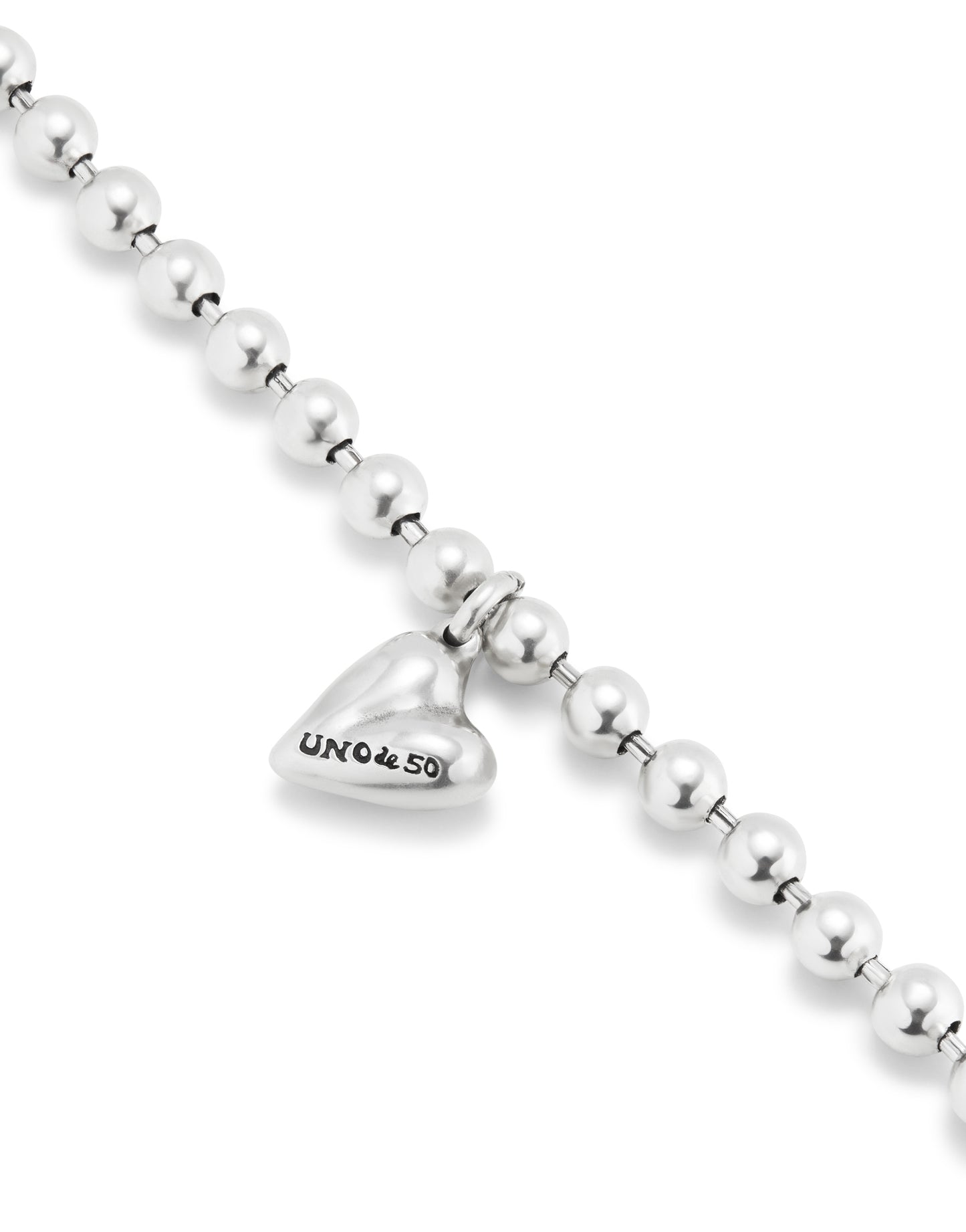 Beaded Bracelet with Heart Charm: features a heart-shaped charm engraved with "UNOde50" on a strand of round sterling silver beads. Available in multiple sizes.