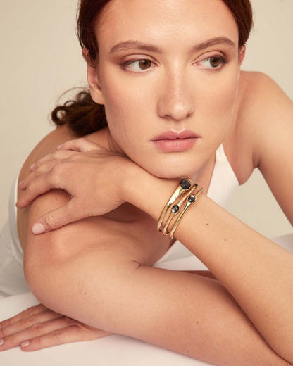 Bangle Bracelets with Crystals and black stone accents, available in small, medium, and large sizes.
