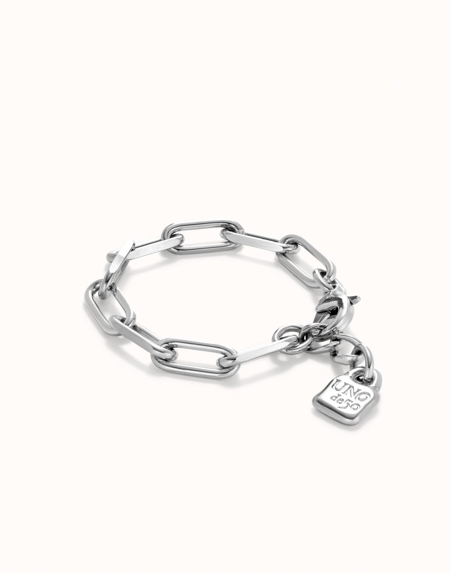 Sterling silver bracelet with oversized oval chain links and a rectangular "KING ICE" padlock charm, polished finish. Available in multiple sizes.