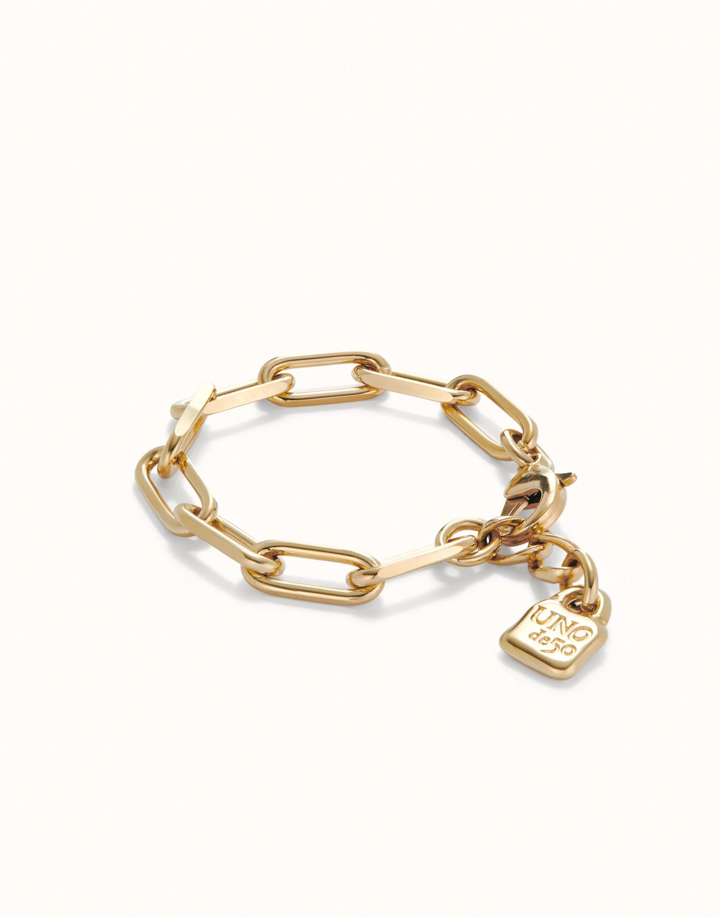 18K gold-plated paper clip link bracelet with a dangling padlock charm engraved with "JUNG DEEP"; available in sizes S, M, and L.