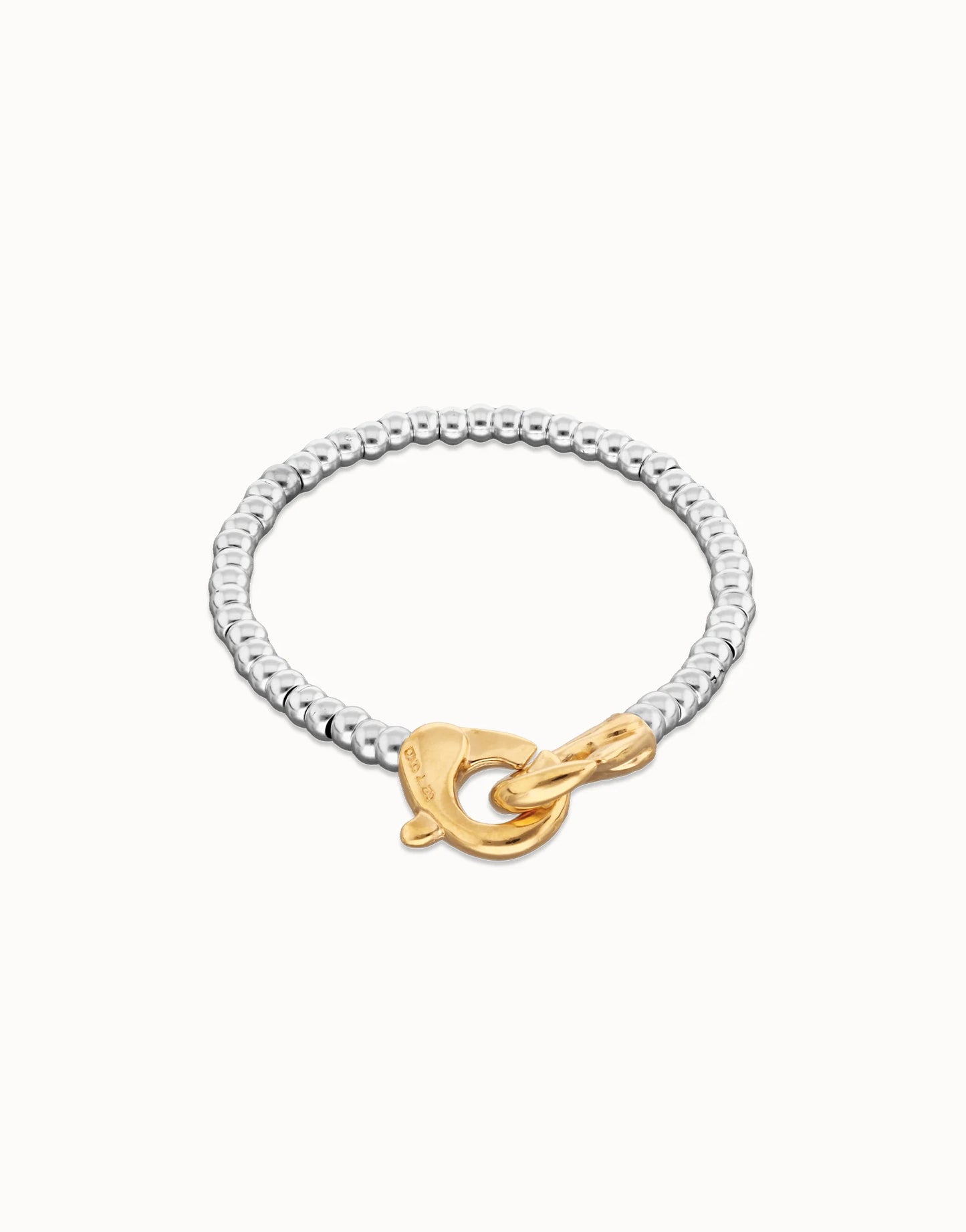 Two-tone beaded bracelet with silver-plated design and gold carabiner clasp; available in multiple sizes.